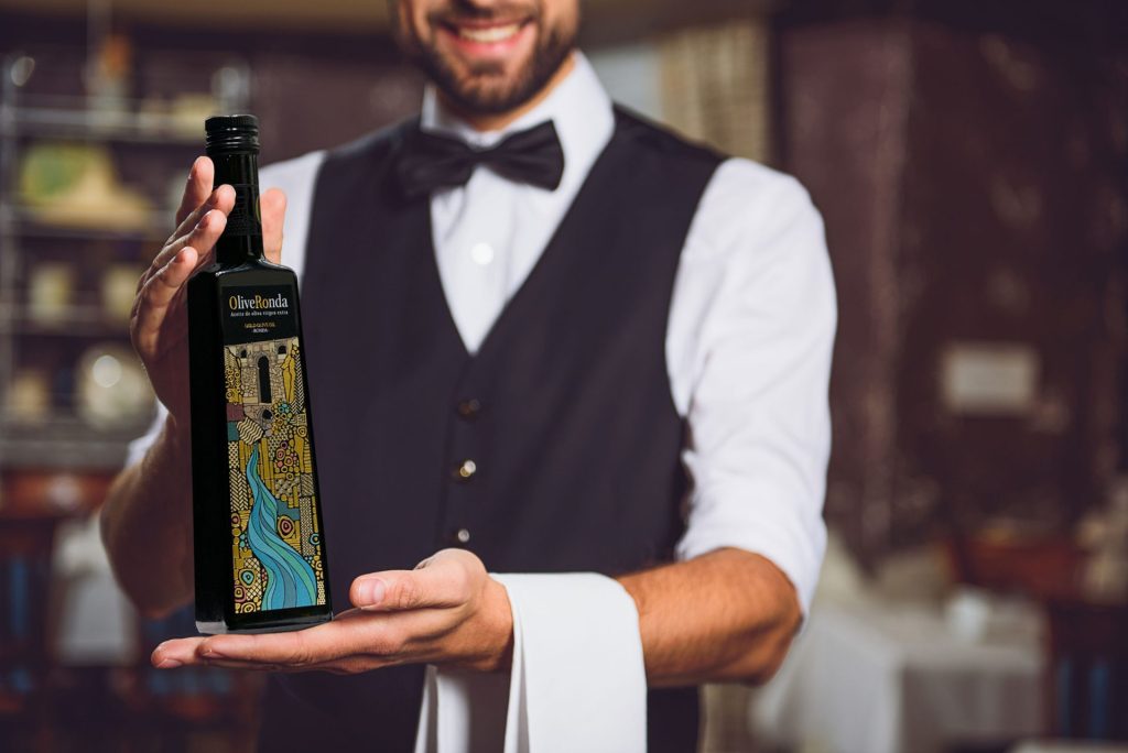 Premium bottle with embellished label showcasing detailed print finishes and craftsmanship, presented in a bar setting.